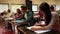 Focused students sitting an exam in a classroom