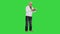 Focused stylish old man reading a book on a Green Screen, Chroma Key.