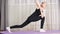 Focused teen girl practicing yoga at home