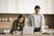 Focused teenager schoolkid girl doing school homework at home