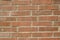 Focused texture of orange solid brick wall