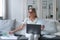 focused woman reading documents at home office