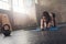 Focused woman stretching on fitness mat