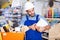 Focused workman choosing materials for renovation works in paint store