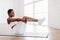 Focused Young Black Woman Doing Crunches Exercise On Yoga Mat