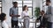 Focused young mixed race interns listening to female boss.