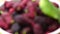 Focusing a pile of fresh mulberries in a white bowl