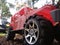 Focusing on a red colour toy car tire, star wheel and blur background.