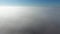 Fog above the ground. Top view of the fog. Low clouds. Morning mist condensation. Shooting with a drone