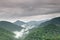 Fog and cloud mountain valley landscape