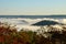 Fog covers the rolling hills below. View from atop Morrow Mountain state park.