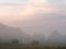 Fog at dawn over a field of farmland