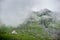 Fog descends to mountains in valley of Fagaras Mountains