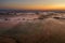 Fog on fields, wind turbines in the background