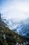 Fog filling gorge by Mount Taranaki. WInter afternoon in Egmont National Park, New Zealand