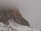 Fog in the mountains. Morning fog covers the rocks in the Italian Dolomites