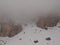 Fog in the mountains. Morning fog covers the rocks in the Italian Dolomites