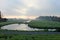 Fog over the ditch and meadows during sunrise with swans in the grass at Park Hitland in Nieuwerkerk aan den Ijssel in the Netherl