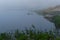 Fog over a quite mountain lake at dawn