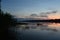 Fog over the river. Forest areas. Water lilies, reeds, reeds