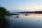 Fog over the river. Forest areas. Water lilies, reeds, reeds