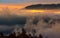 Fog rise in mountains at sunrise