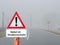 Fog warning sign in road traffic in german