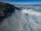 Foggy aerial views at the top of enormous mountains