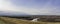 Foggy autumn landscape of mountains with valleys and river. Pano