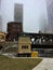 Foggy Chicago evening as elevated `el` train passes over the river and Lake Street bridge.