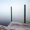 Foggy coastal abstract, frozen wooden pier