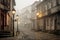 foggy cobblestone street with vintage lampposts