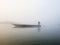 Foggy dawn in Chitwan. Morning on the river in canoe