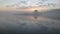 Foggy dawn over the lake early morning sunrise