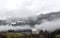 A Foggy day with view of snowfall line in a valley in Upper Austria