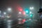 Foggy deserted crossroads with traffic lights
