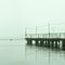 foggy dock. pier, autumn silence. calm. fishermen.