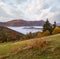 Foggy early morning autumn mountains scene. Peaceful picturesque traveling, seasonal, nature and countryside beauty concept scene