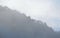 Foggy floating and cover mountain slope