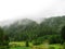 Foggy forest with clouds in Lacul Rosu lake, Transsylvania, Romania