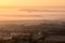 A foggy, frosty winters sunrise. With layers of mist over the English Countryside. Worcestershire. UK.