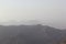 Foggy Jabal Jais mountain and desert landscape near Ras al Khaimah, UAE