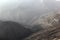Foggy Jabal Jais mountain and desert landscape near Ras al Khaimah, UAE