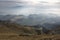 Foggy layered mountain landscape in Piatra Craiului mountains