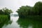 Foggy misty natural chinese landscape. Park with lake near Summer Palace, Beijing