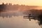 Foggy morning over calm river, pink fog against morning sun, fisherman place. Ukraine, peace