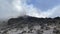 Foggy mountain landscape. Broken stones and boulders. Climbing Kilimanjaro, Africa