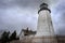 Foggy Pemaquid Point Lighthouse and Keepers House From Below Fence