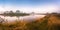 Foggy river in the morning. Panorama. Warm summer morning