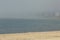 Foggy, sandy, crescent beach on the Connecticut shoreline in Niantic